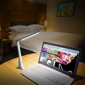 2670 daylight smart travel lamp shown lighting laptop in dim room