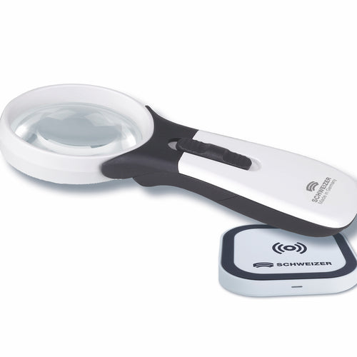 ERGO Lux magnifier resting on wireless charging pad